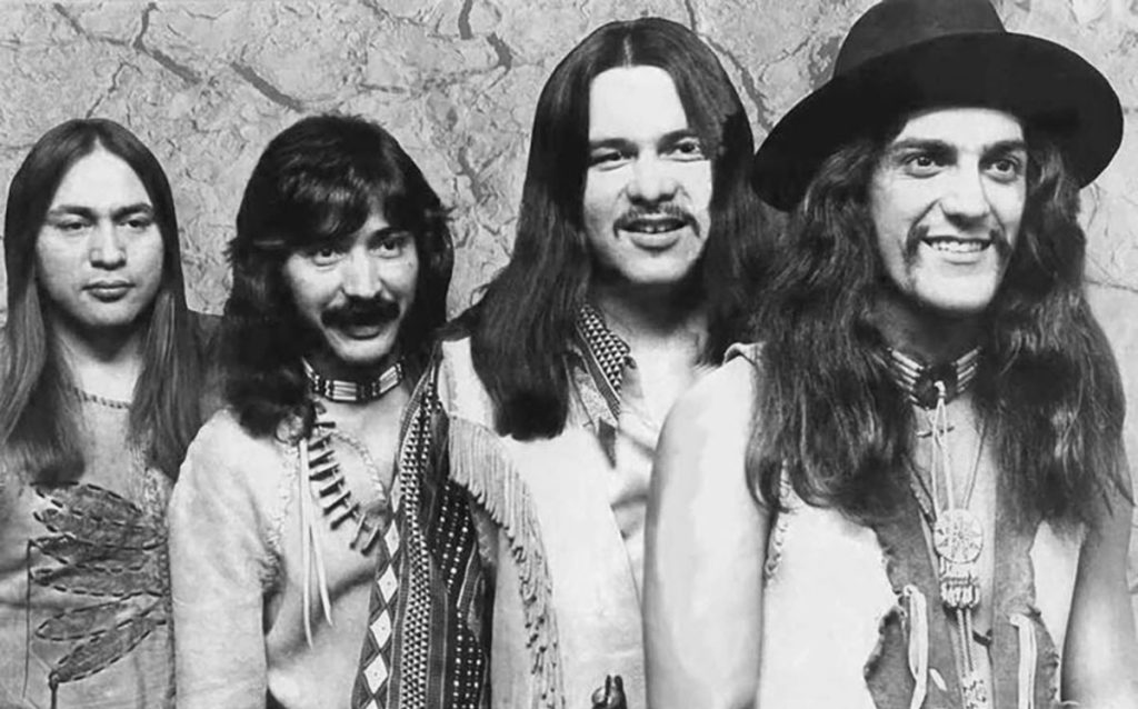 Black and white photograph of the band redbone all in a line