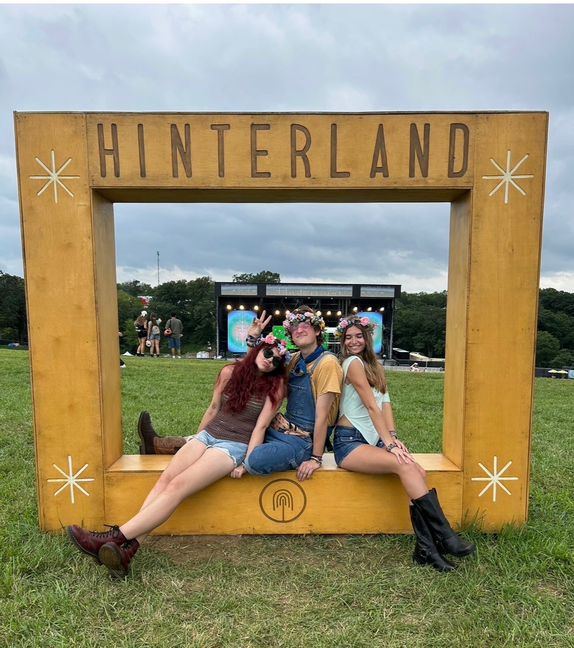 Caylie and friends posting in yellow framed box, Hinterland written above in brown
