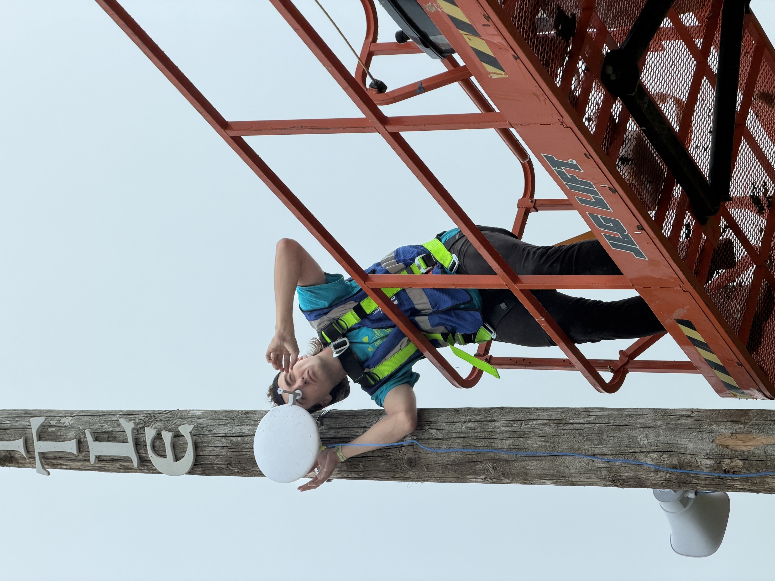 Elliot on the job in a boom lift