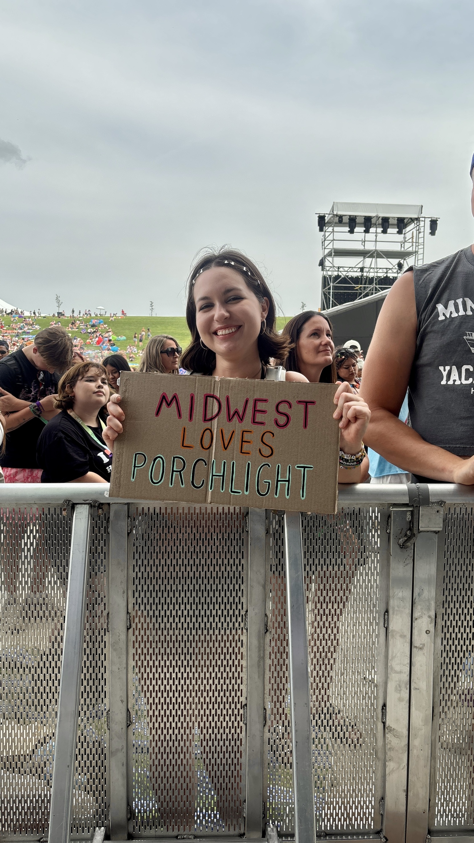 Porch Light fan holding up a sign they made during the Porch Light set