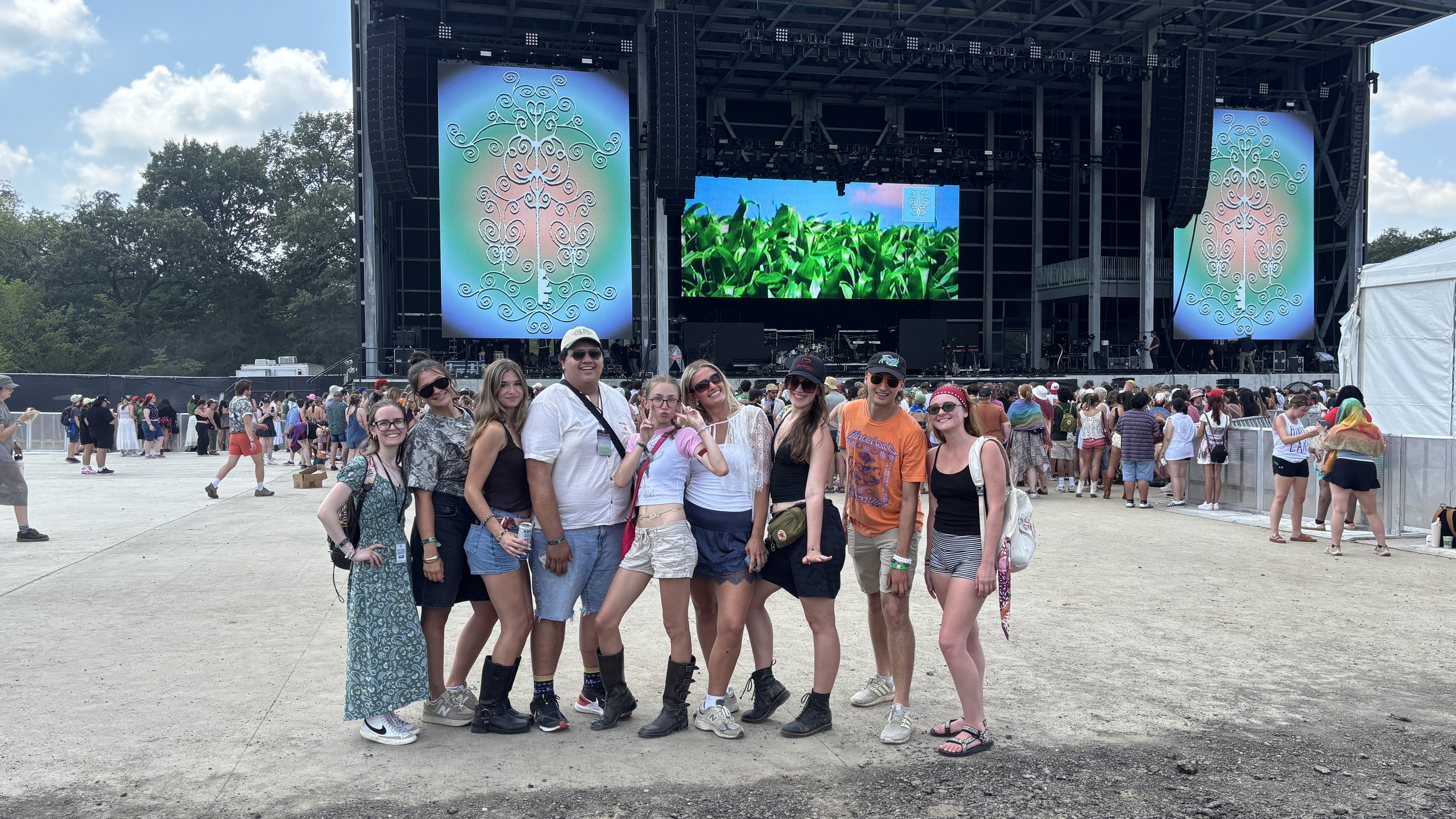 SCOPE members pose in front of the stage