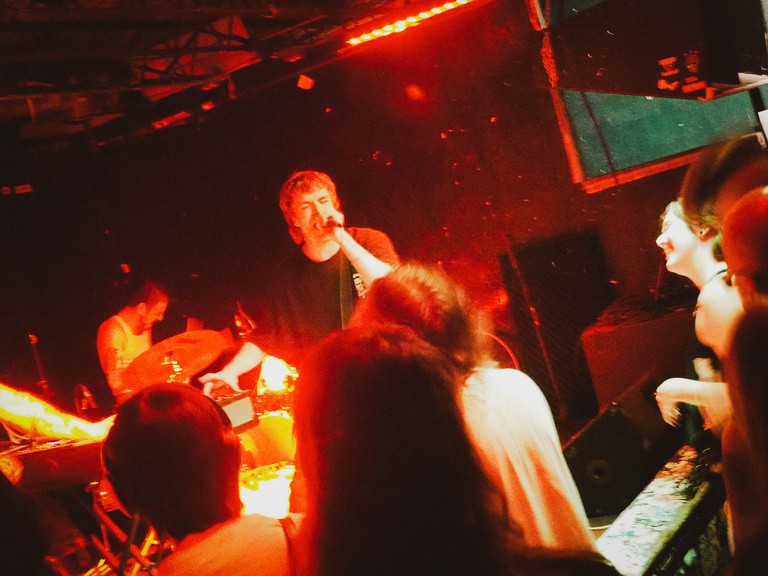 Lip Critic on stage, view of the crowd enjoying the performance