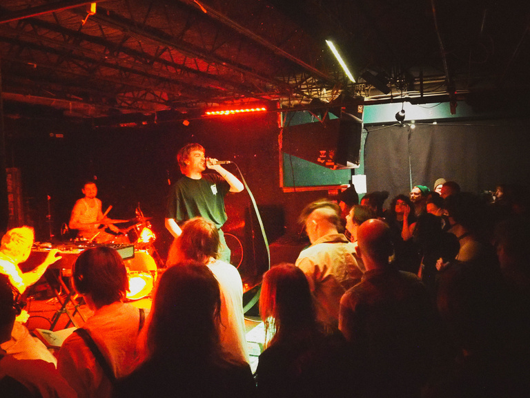 Lip critic on stage with crowd view