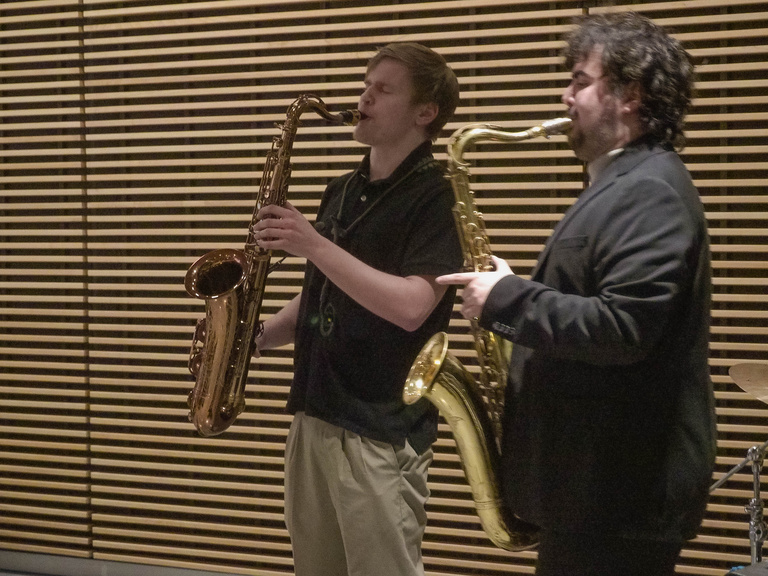 Both saxophone acts performing the last song of the evening together. 