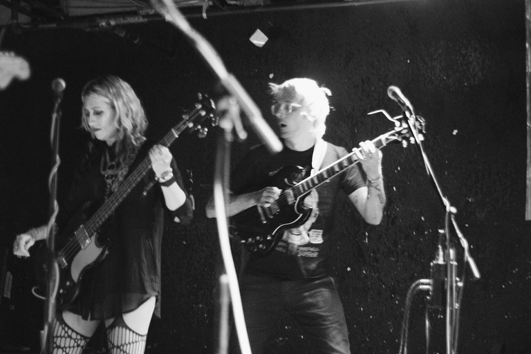 Black and white image of Frankie and the Witch Fingers on stage